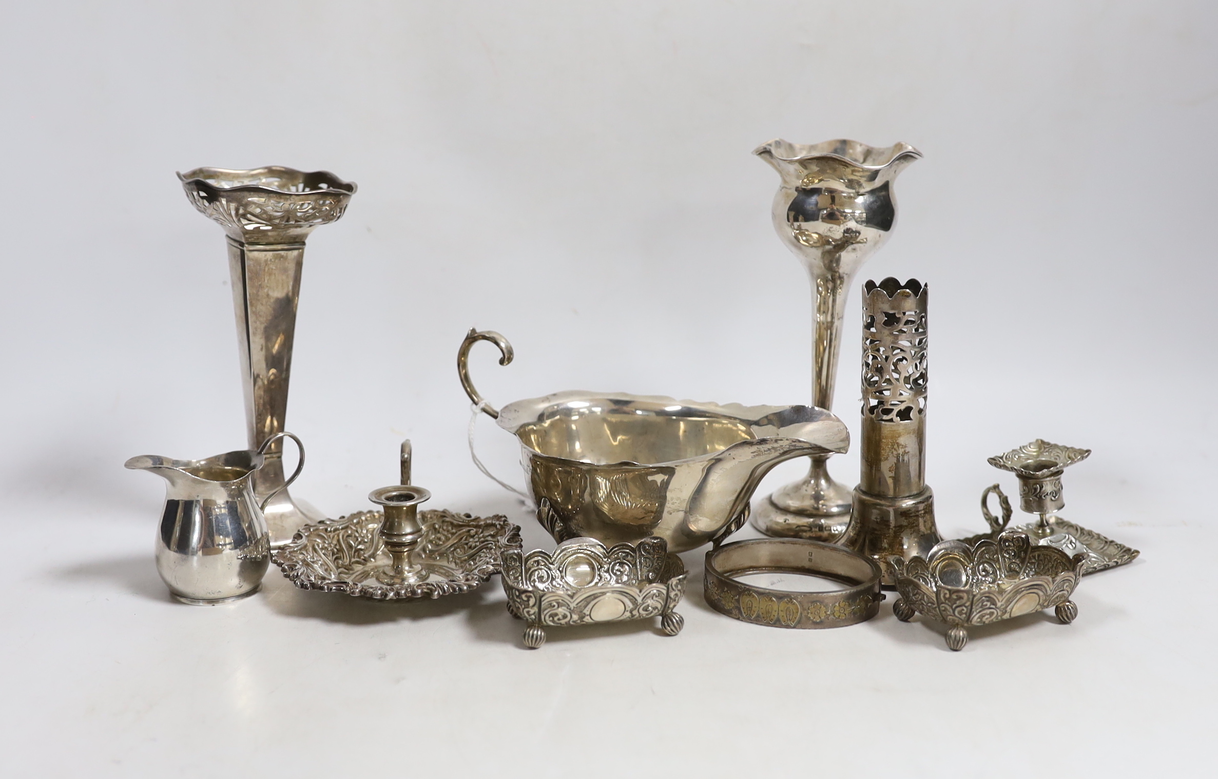 Sundry small silver including a sauceboat, two mounted posy vases, pair of salts, small cream jug, mounted vase section, chamberstick and a hinged bracelet, together with a small 800 standard chamberstick.